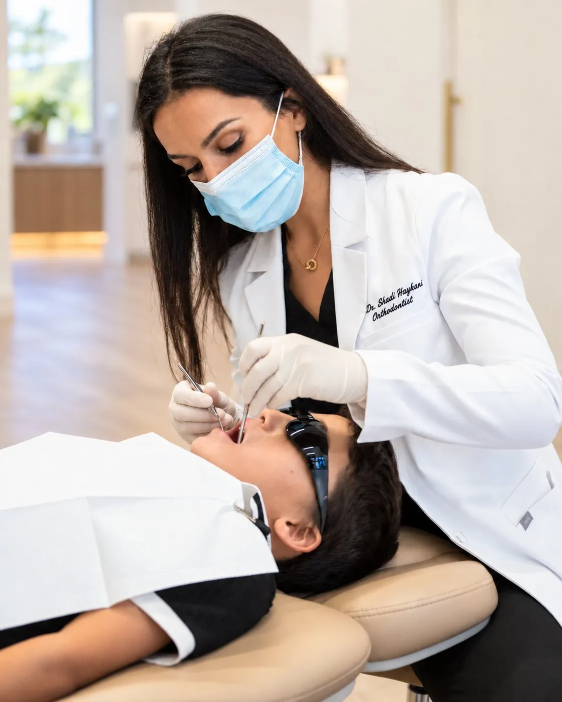 Dr. Haykani examining a patient at SC Orthodontics.