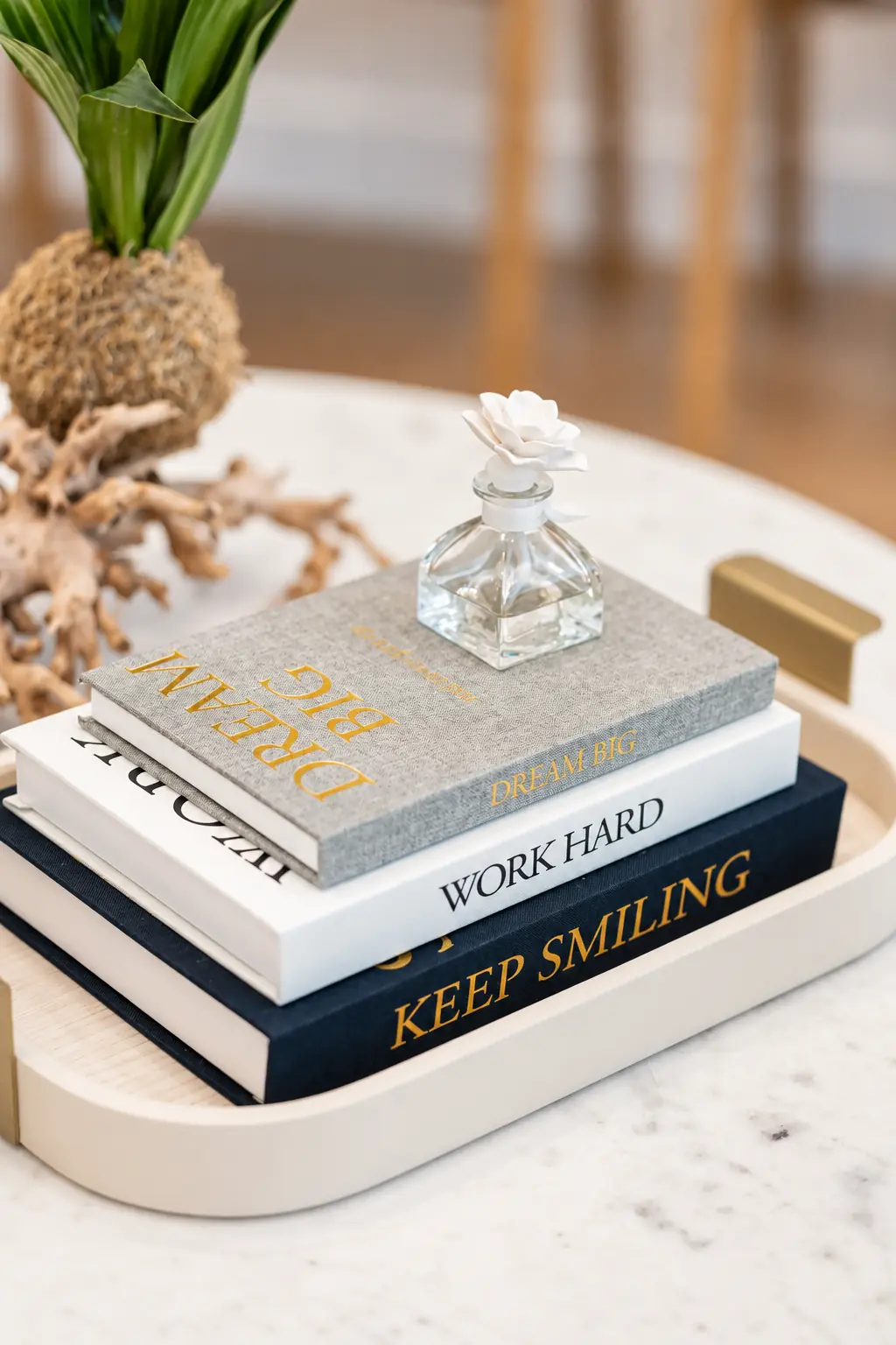 Books and a diffuser on the waiting-area table at SC Orthodontics