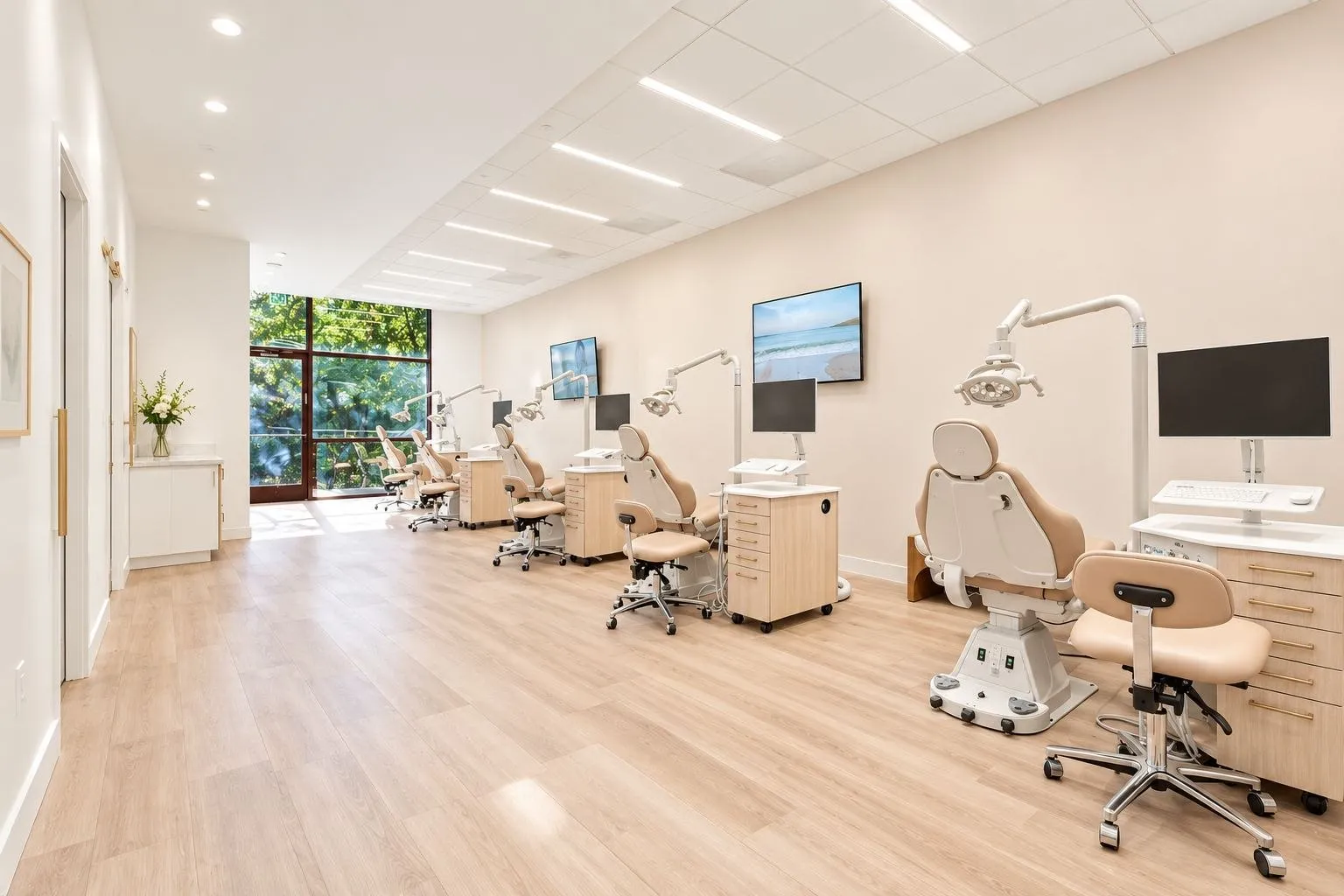 The open treatment bay at SC Orthodontics in Valencia, with daylight at the end of the room