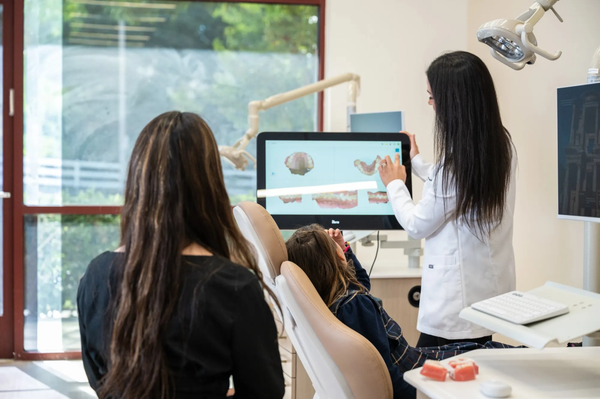 Dr. Haykani reviewing a plan with a patient at SC Orthodontics
